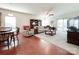 Bright living room featuring a ceiling fan, cozy furniture, and sliding glass doors at 1228 Tranquil Falls Ln, Matthews, NC 28104