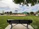 Neighborhood playground features various play structures, shade canopies, and seating for families to enjoy at 1228 Tranquil Falls Ln, Matthews, NC 28104