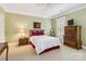 Bright bedroom with white trim, carpet, natural light, and traditional decor at 1302 Warrington Pl, Rock Hill, SC 29732