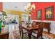 Elegant dining room with chandelier, hardwood floors, and views into sunroom at 1302 Warrington Pl, Rock Hill, SC 29732