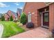 Home exterior featuring well-manicured landscaping and a brick pathway to the front door at 1302 Warrington Pl, Rock Hill, SC 29732