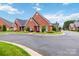 Beautiful brick home with a well-kept lawn and landscaping, creating a welcoming view at 1302 Warrington Pl, Rock Hill, SC 29732