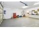 Garage featuring painted floor, work bench and door to house at 1302 Warrington Pl, Rock Hill, SC 29732