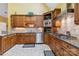 Updated kitchen with stainless steel appliances, custom cabinetry, and tile backsplash at 1302 Warrington Pl, Rock Hill, SC 29732