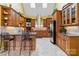 Spacious kitchen featuring custom wood cabinetry, stainless steel appliances, granite counters, and skylights at 1302 Warrington Pl, Rock Hill, SC 29732