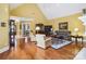 Elegant living room with hardwood floors, tall ceilings, and refined furnishings at 1302 Warrington Pl, Rock Hill, SC 29732