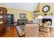 Cozy living room featuring a fireplace, hardwood floors, and comfortable seating arrangements at 1302 Warrington Pl, Rock Hill, SC 29732