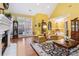 Bright living room featuring a fireplace, large windows, and hardwood floors at 1302 Warrington Pl, Rock Hill, SC 29732