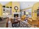Comfortable living room with fireplace, large windows, and open layout at 1302 Warrington Pl, Rock Hill, SC 29732