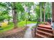 Spacious backyard featuring a basketball court, mature trees, and a well-maintained lawn at 1304 5Th Street Nw Cir, Hickory, NC 28601