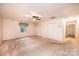 Bedroom with a ceiling fan, window with curtains, and large closets at 1304 5Th Street Nw Cir, Hickory, NC 28601