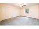Bedroom featuring carpet, a ceiling fan and natural light from window at 1304 5Th Street Nw Cir, Hickory, NC 28601