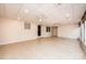 Spacious bonus room with tile flooring, ceiling fans, and natural light from the backyard at 1304 5Th Street Nw Cir, Hickory, NC 28601