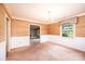 Charming dining room with wainscoting, chandelier, and view to the backyard at 1304 5Th Street Nw Cir, Hickory, NC 28601
