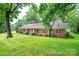Beautiful brick home with a large front yard and mature trees at 1304 5Th Street Nw Cir, Hickory, NC 28601
