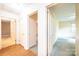Hallway with wood floor leading to carpeted hallway at 1304 5Th Street Nw Cir, Hickory, NC 28601