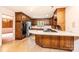 Well-equipped kitchen with wooden cabinets, stainless steel appliances, and a functional cooktop island at 1304 5Th Street Nw Cir, Hickory, NC 28601