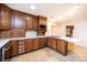 Spacious kitchen featuring classic wood cabinetry, plenty of storage, and functional island with cooktop at 1304 5Th Street Nw Cir, Hickory, NC 28601