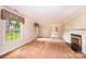 Spacious living room featuring a fireplace and ample natural light from large windows at 1304 5Th Street Nw Cir, Hickory, NC 28601