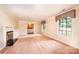 Elegant living room with fireplace, large windows, and crown molding, creating a cozy atmosphere at 1304 5Th Street Nw Cir, Hickory, NC 28601