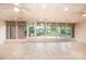Spacious sunroom with walls of windows and access to the backyard at 1304 5Th Street Nw Cir, Hickory, NC 28601