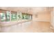 Bright sunroom featuring large windows, tiled floor, and access to the backyard at 1304 5Th Street Nw Cir, Hickory, NC 28601