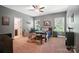 Comfortable bedroom with carpeted floors, a ceiling fan, and ample sunlight at 16229 Loch Raven Rd, Huntersville, NC 28078