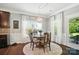Cozy breakfast nook with a round table, bright windows, and stylish decor at 16229 Loch Raven Rd, Huntersville, NC 28078