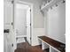 Well-organized entryway with bench seating, shelf storage, and convenient access to a half bath at 16229 Loch Raven Rd, Huntersville, NC 28078