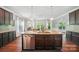 Bright kitchen featuring an island with bar seating, stainless steel appliances, and an eat-in dining area at 16229 Loch Raven Rd, Huntersville, NC 28078