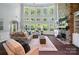 Spacious living room with fireplace and lots of natural light at 16229 Loch Raven Rd, Huntersville, NC 28078