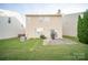 Backyard featuring a patio, lawn, and mature trees at 16525 Kettlewell Ln, Charlotte, NC 28277