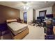 Bedroom featuring a ceiling fan and a desk with computers at 16525 Kettlewell Ln, Charlotte, NC 28277