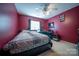 Bedroom featuring a ceiling fan, natural light, and a comfortable bed at 16525 Kettlewell Ln, Charlotte, NC 28277