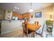 Cozy dining area with natural light, wood table and chairs adjacent to the kitchen at 16525 Kettlewell Ln, Charlotte, NC 28277