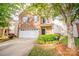 Inviting two-story brick home with a two car garage and well-manicured landscaping at 16525 Kettlewell Ln, Charlotte, NC 28277