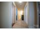 Hallway with neutral paint and carpet leading to the other rooms in the home at 16525 Kettlewell Ln, Charlotte, NC 28277