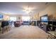 Open living room featuring a plush sofa, fireplace, and entertainment center with TV at 16525 Kettlewell Ln, Charlotte, NC 28277