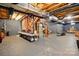 Spacious unfinished basement with exposed ceiling, concrete floors, and potential for various uses at 1720 Mountain Park Dr, Charlotte, NC 28214