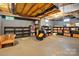 Unfinished basement space providing ample storage with shelving, boxes, and concrete flooring at 1720 Mountain Park Dr, Charlotte, NC 28214
