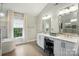 Bathroom with a soaking tub, glass enclosed shower, and double sink vanity at 1720 Mountain Park Dr, Charlotte, NC 28214