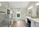 A luxurious bathroom with a soaking tub, glass-enclosed shower and double vanity at 1720 Mountain Park Dr, Charlotte, NC 28214