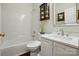 Bathroom with a tub and shower, marble counter top, and updated fixtures at 1720 Mountain Park Dr, Charlotte, NC 28214