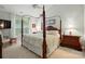 A bright bedroom featuring a canopy bed and a window with natural light at 1720 Mountain Park Dr, Charlotte, NC 28214