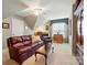 An inviting bonus room features a comfortable seating area and vintage furniture at 1720 Mountain Park Dr, Charlotte, NC 28214