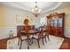 Traditional dining room with a large china cabinet and decorative wall art at 1720 Mountain Park Dr, Charlotte, NC 28214