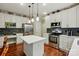Spacious kitchen features white cabinets, island, and stainless steel appliances at 1720 Mountain Park Dr, Charlotte, NC 28214