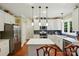 Modern kitchen with white cabinets, stainless steel appliances, and dark backsplash at 1720 Mountain Park Dr, Charlotte, NC 28214