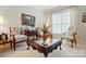 Bright and inviting living room with a comfortable seating arrangement and a large window at 1720 Mountain Park Dr, Charlotte, NC 28214