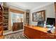 Home office featuring built-in shelves, a large desk, and natural light at 1720 Mountain Park Dr, Charlotte, NC 28214
